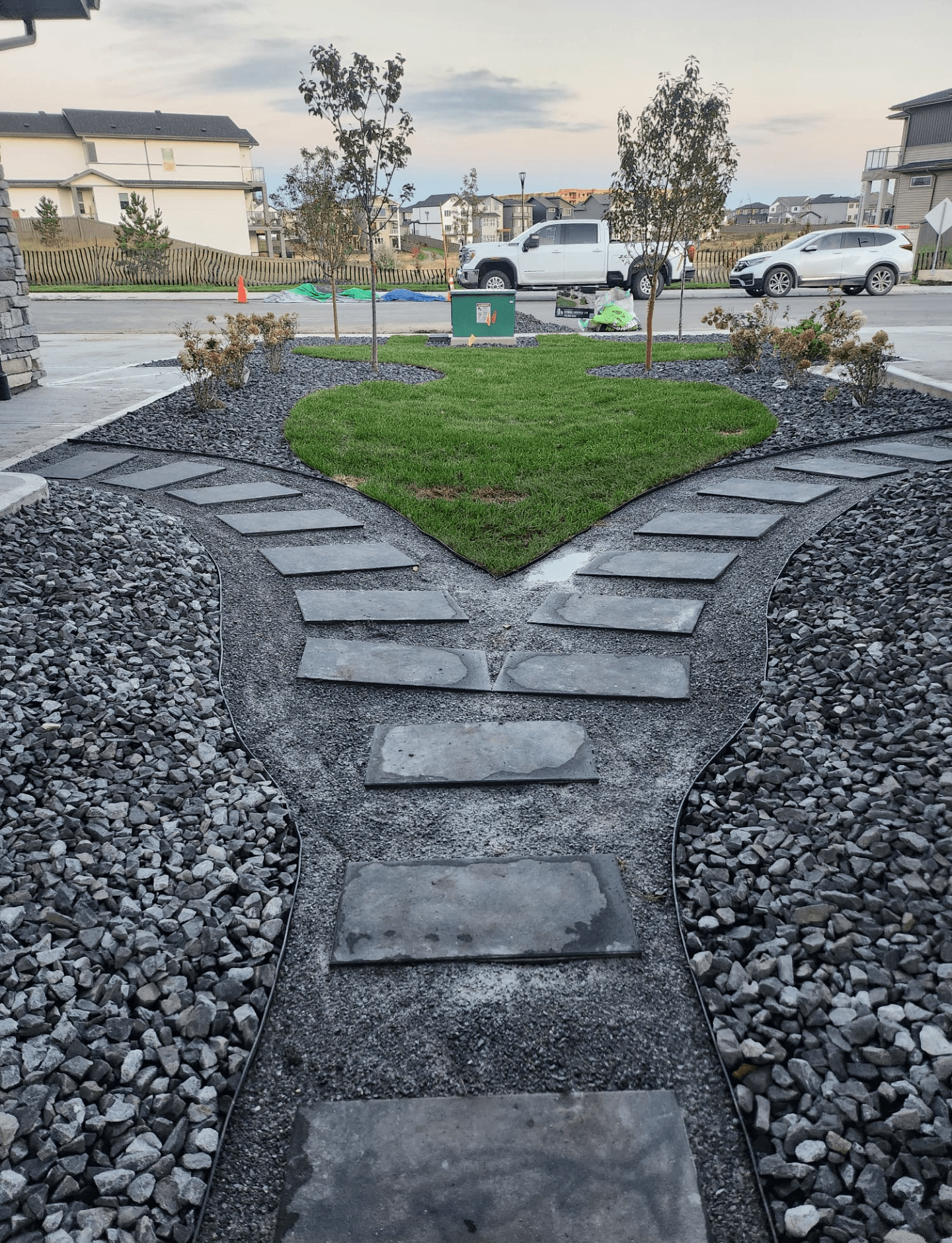 New home landscaping in Edmonton with connecting pathway